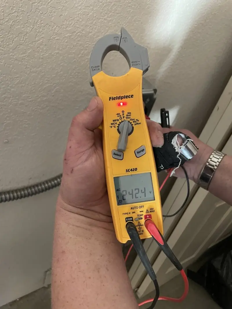 Voltage testing with clamp meter during Recessed Lighting Installation in Hampshire